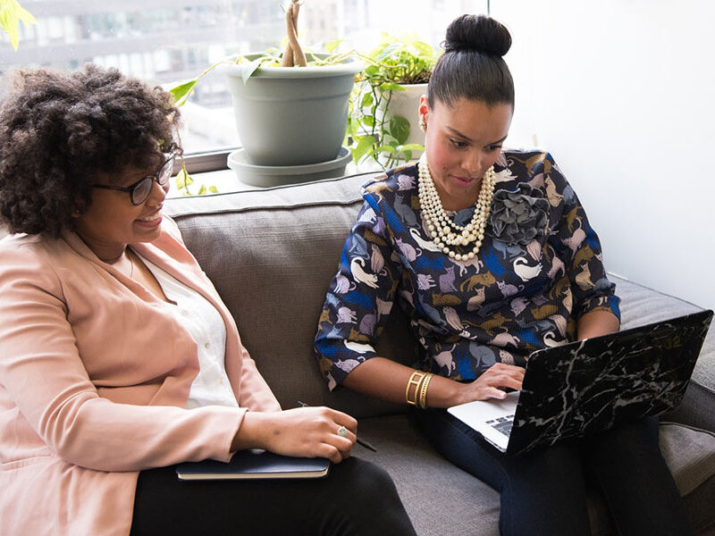 Two women on laptops