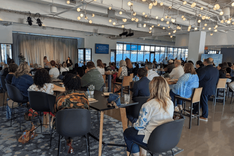 Individuals listening to presentation